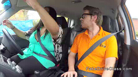 Busty Cookie gets pounded in a driving school car while being secretly filmed