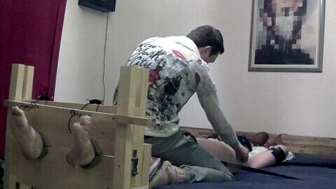 Boy tied up, blindfold, foot tickling